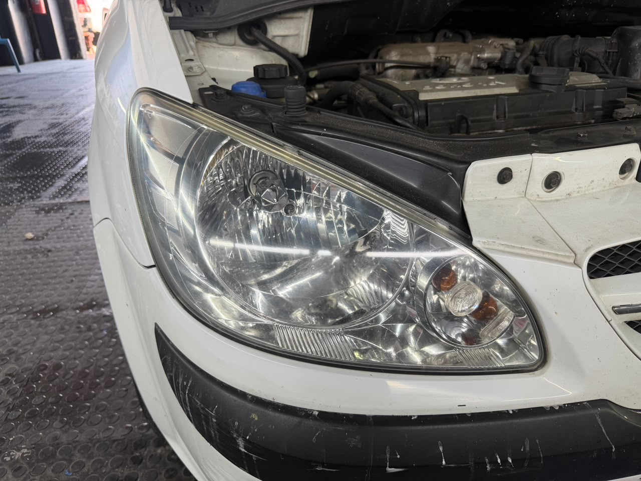 Restored clear headlight on a white vehicle